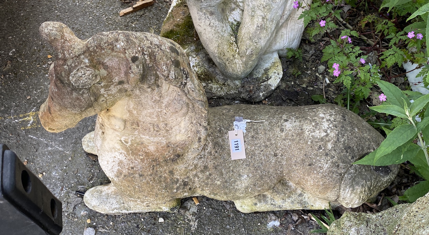 A reconstituted stone recumbent horse, height 55cm *Please note the sale commences at 9am.